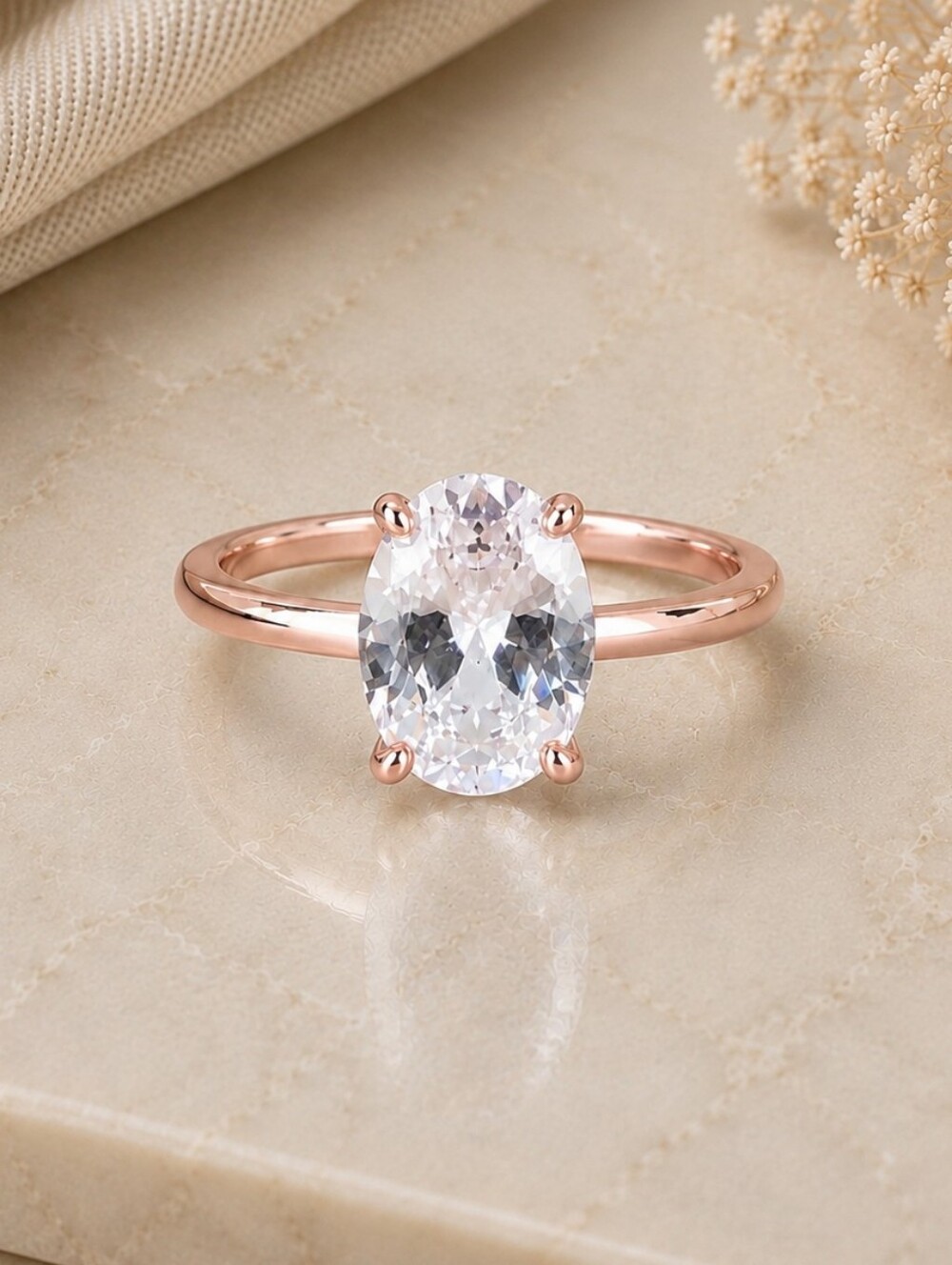 Rose Gold Oval Solitaire Ring with Clear Gem